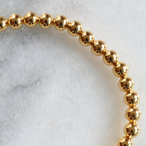 Close up pf Libby & Smee gold plated bangle bracelet 