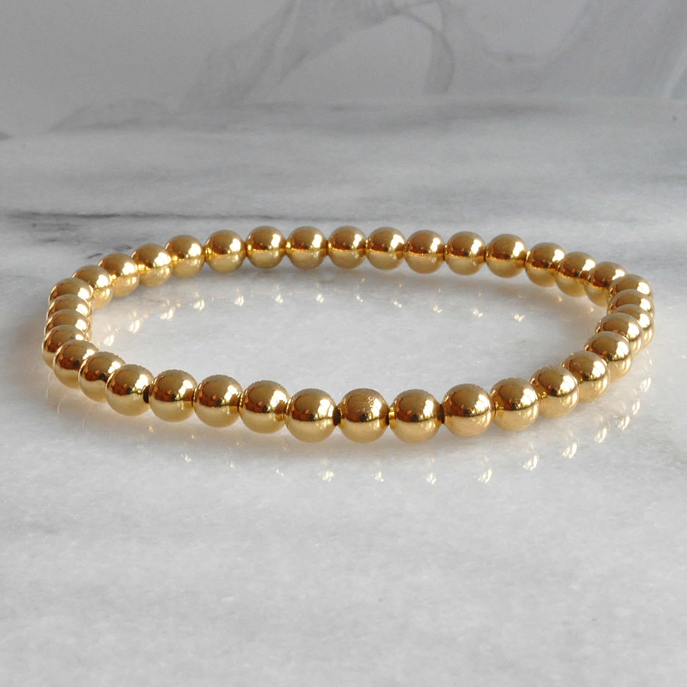 Gara Danielle Elastic Bracelet with 14k Gold-Filled 4mm Beads | The NOW  Massage