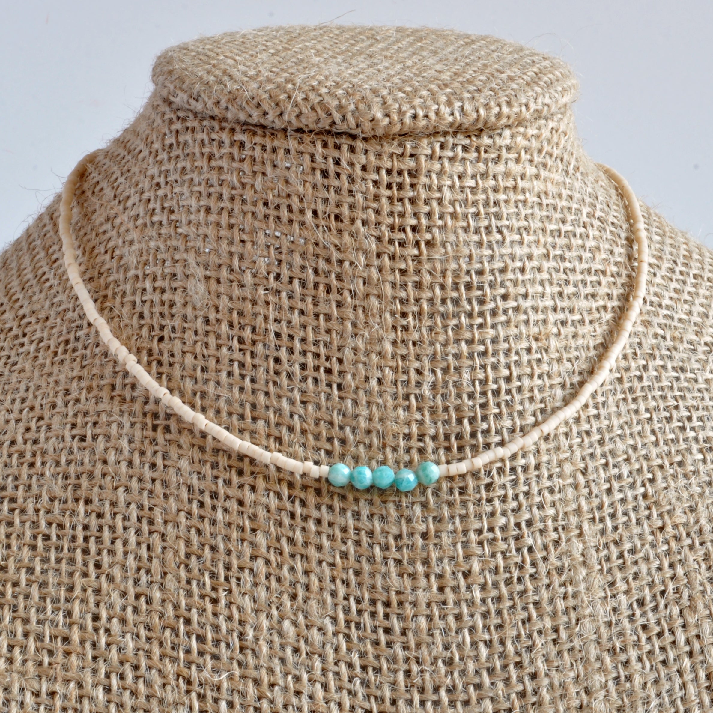 Libby & Smee matte cream beaded choker necklace with turquoise Amazonite accent beads on mannequin
