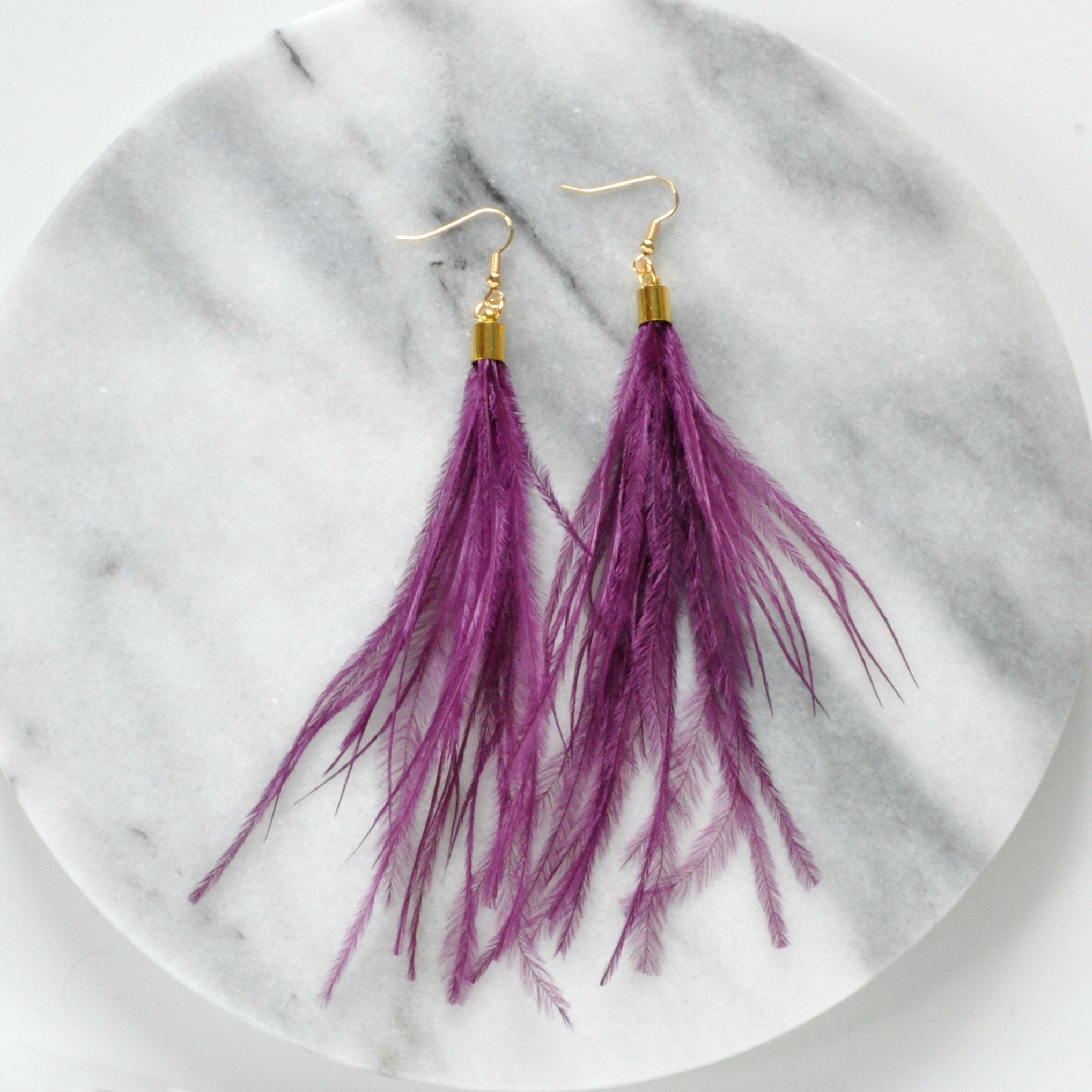 Libby & Smee Purple Feather Earrings with Ostrich feathers and gold caps, still life