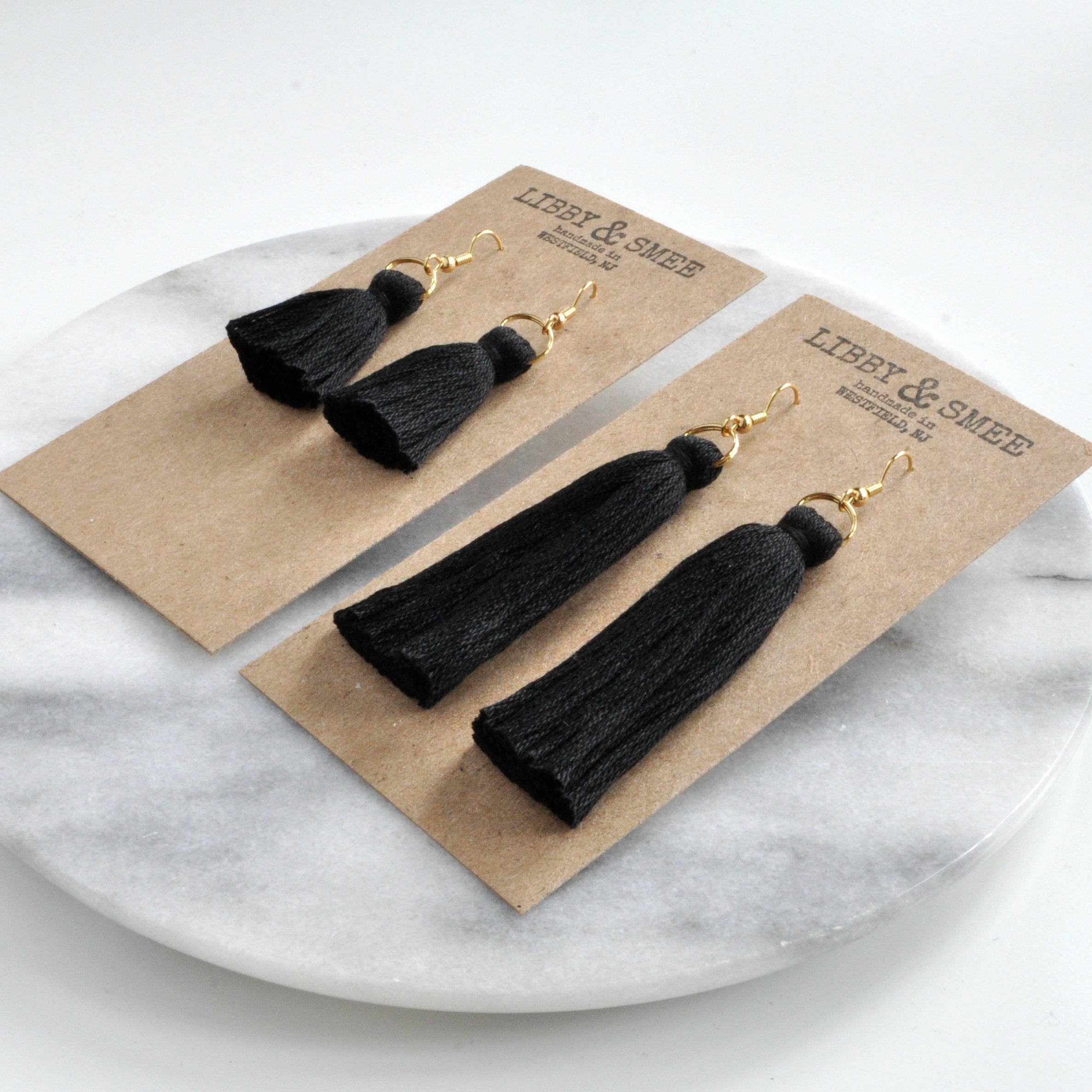 Libby & Smee black tassel earrings in mini and long, still life on kraft earring cards, s angleide