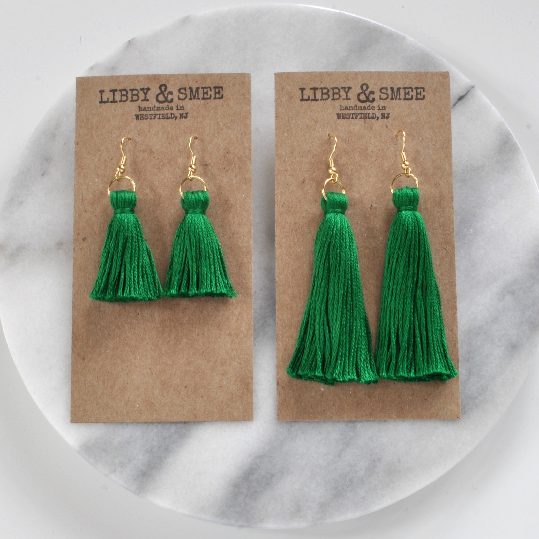 Emerald Green tassel earrings from Libby & Smee shown in mini and long sizes on logo-stamped kraft earring cards