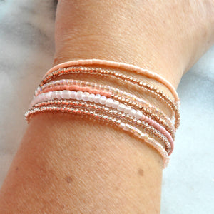 Libby & Smee beaded wrap bracelet strand in blush, on model