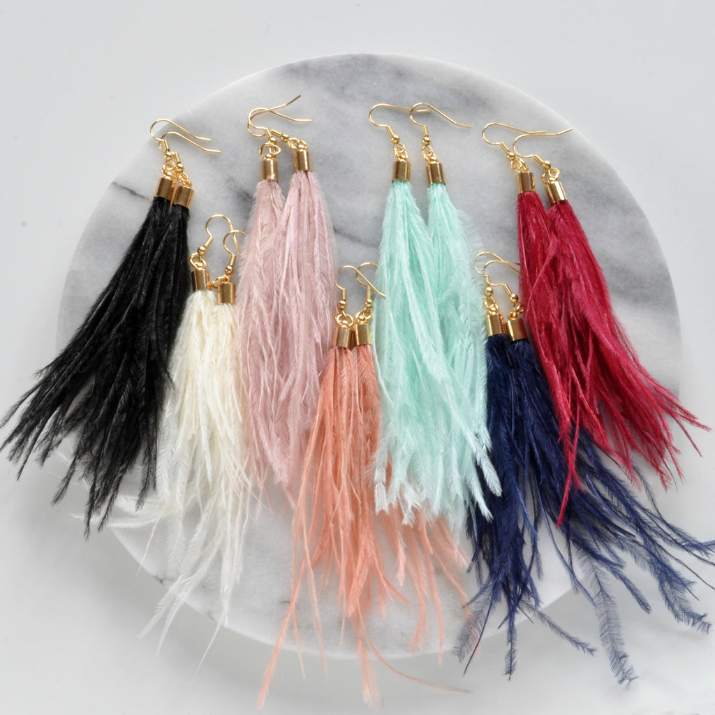 Libby & Smee Ostrich Feather Earrings with Gold caps, Still life of Black, Ivory, Pale Pink, Peach, seafoam, Navy Blue and Red ostrich feather Earrings