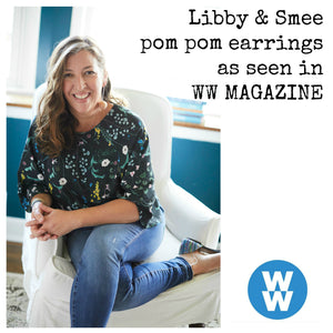 Libby & Smee pom pom earrings in Blush color on model, labeled as seen in WW magazine