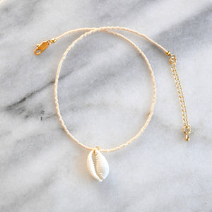 Libby & Smee Seashell Choker Necklace in cream with a cowrie seashell, still life