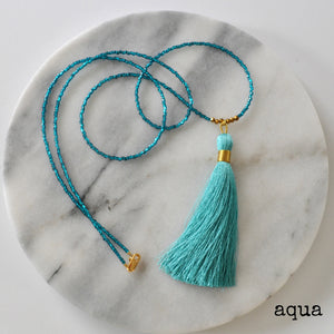 Libby & Smee Beaded Tassel Necklace in Aqua, still life labeled