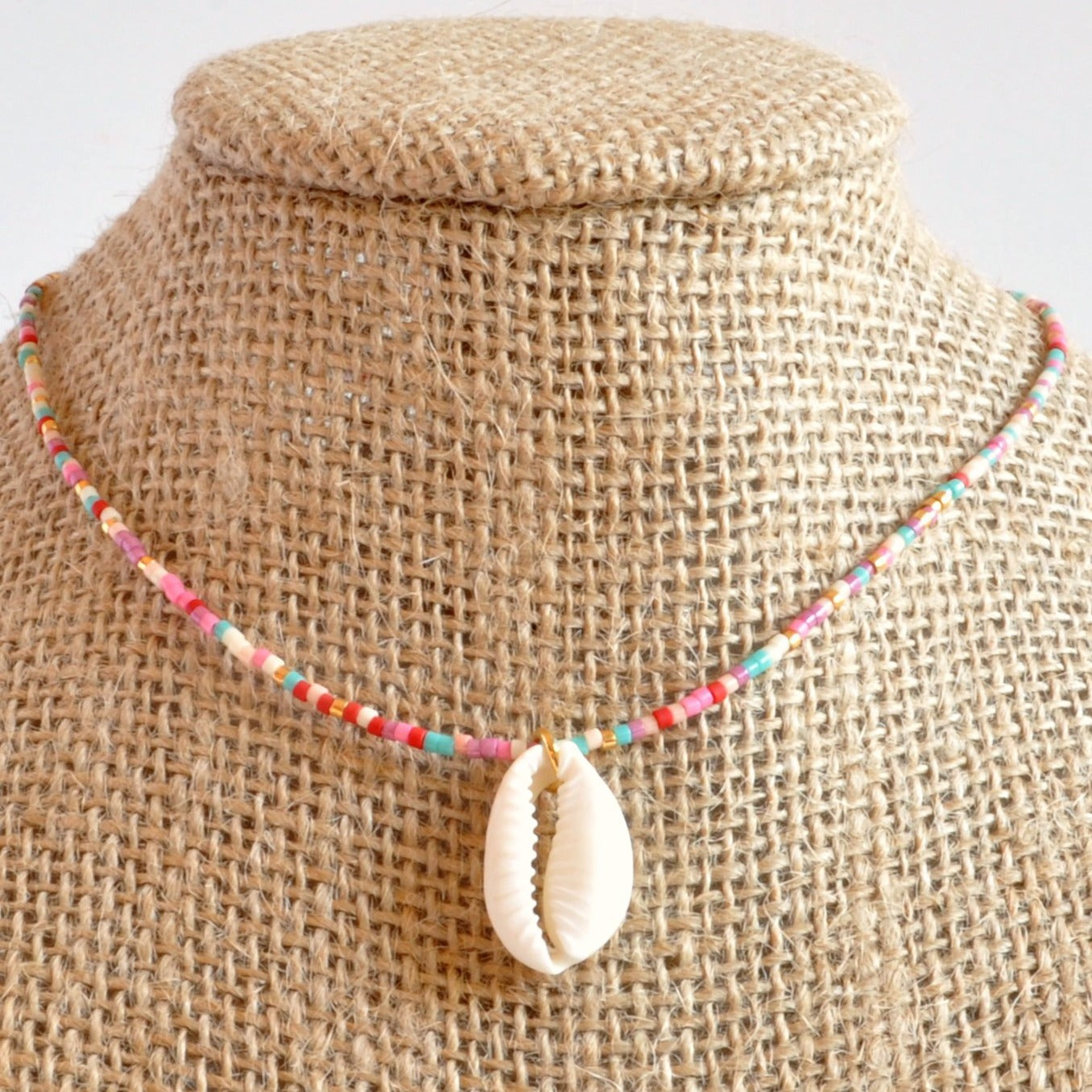 Libby & Smee Seashell Choker Necklace in Cotton Candy Mix: pink, purple, peach gold, ivory, on mannequin