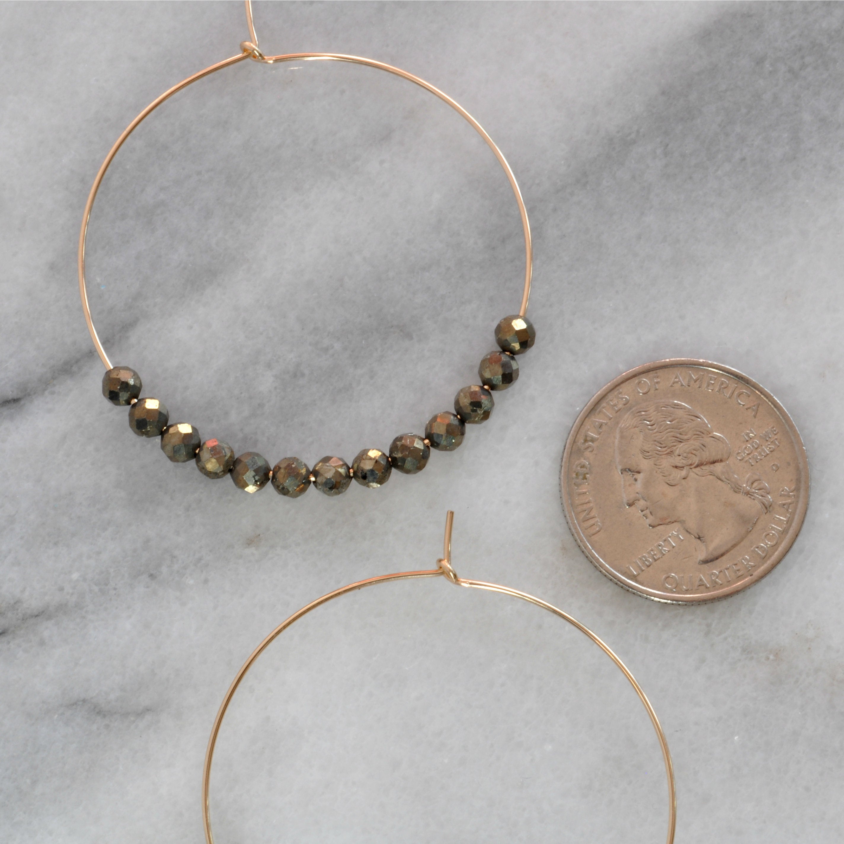 Libby & Smee Pyrite Beaded Earrings, still life with quarter for scale