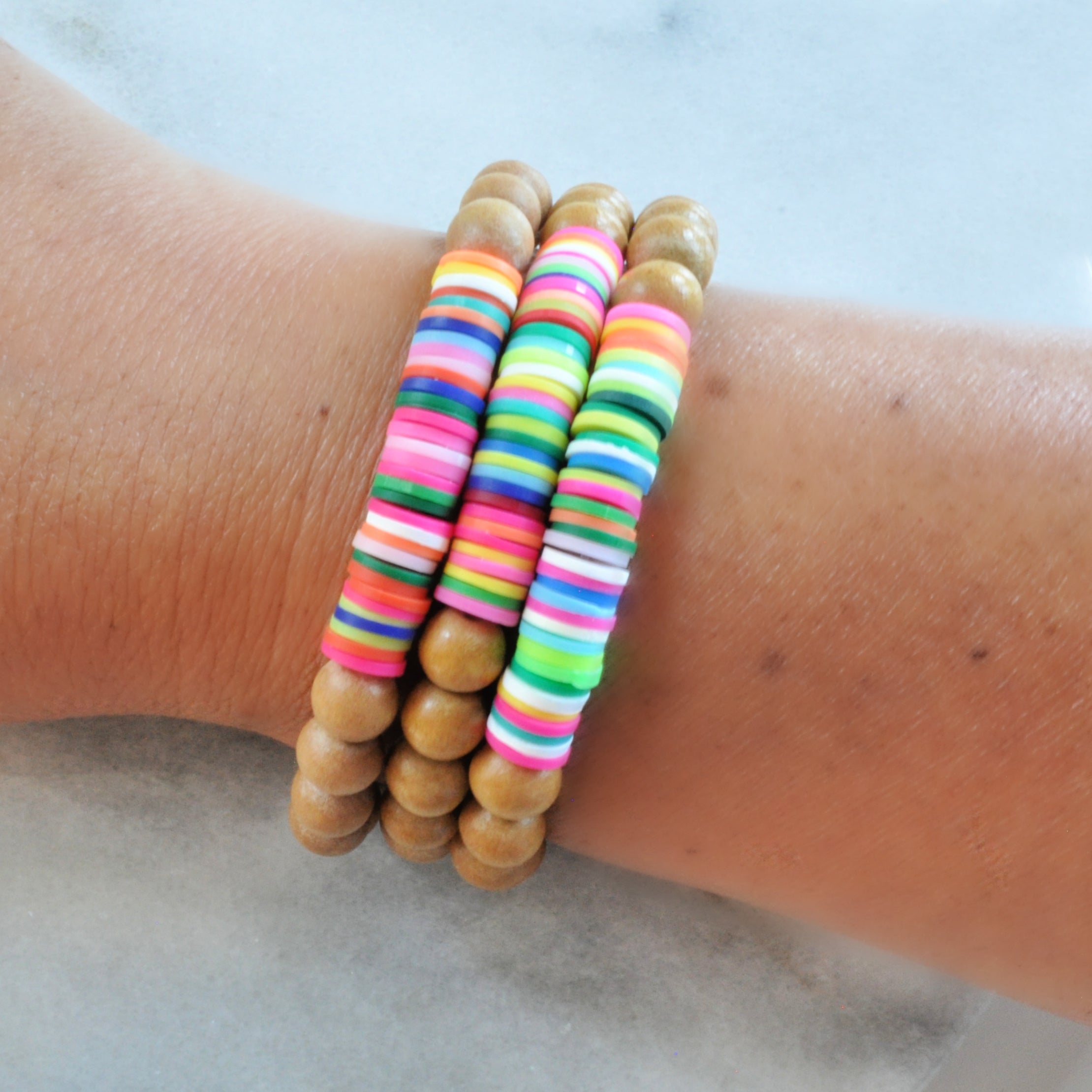 Wood and Heishi bead Bracelets from Libby & Smee shown on wrist